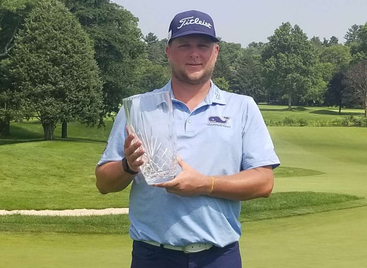Peter Ballo poses with the championship hardware after winning the 87th Connecticut Open at Country Club of Darien on Wednesday.