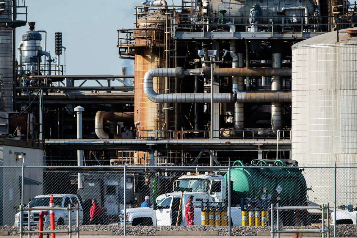 Workers at a LyondellBasell facility in La Porte off of Miller Cut Off Road, Wednesday, July 28, 2021, in La Porte. A chemical leak killed two people and sent 30 to the hospital on Tuesday night at a LyondellBasell facility near La Porte.