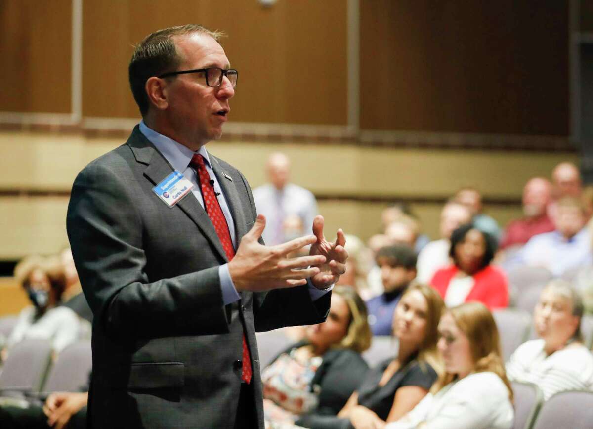 Conroe ISD Superintendent Curtis Null welcomes new teachers during orientation at Grand Oak High School on July 28. The school board approved a $596 million budget with a lower tax rate.