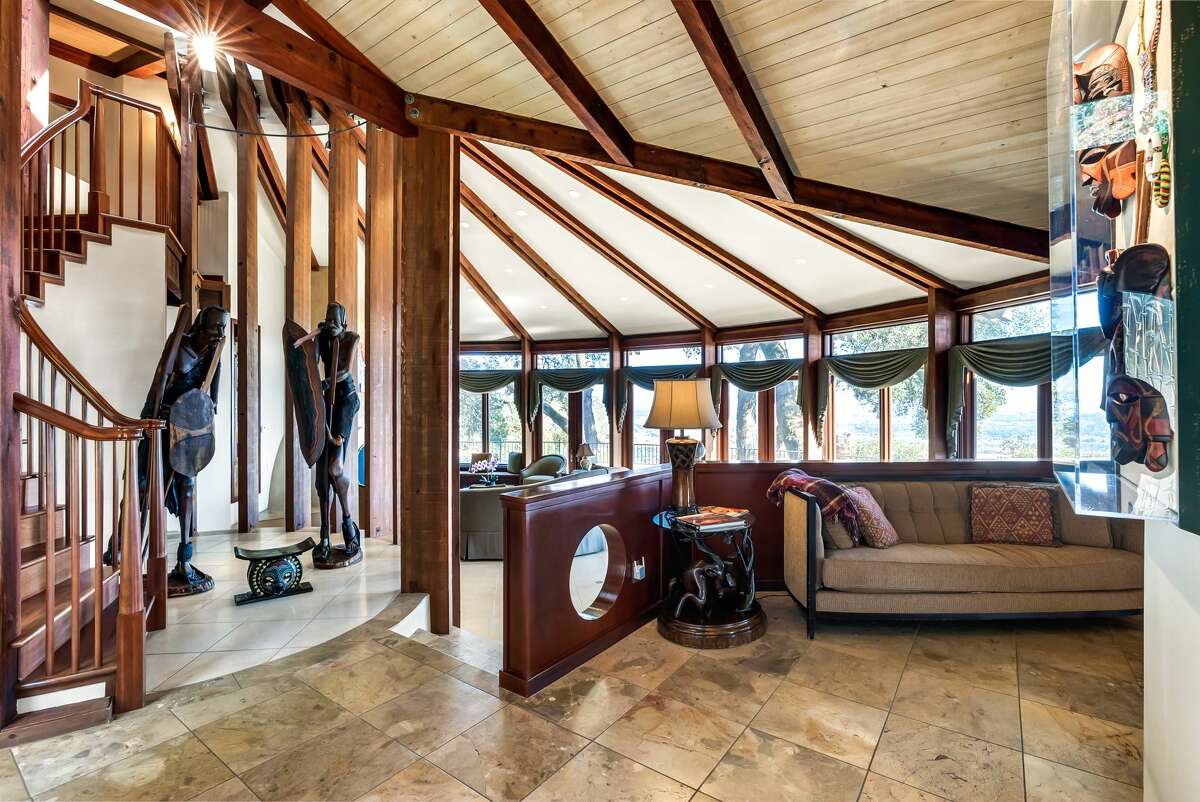 It's a custom built abode, with a unique geometric design and exposed beam accents. 