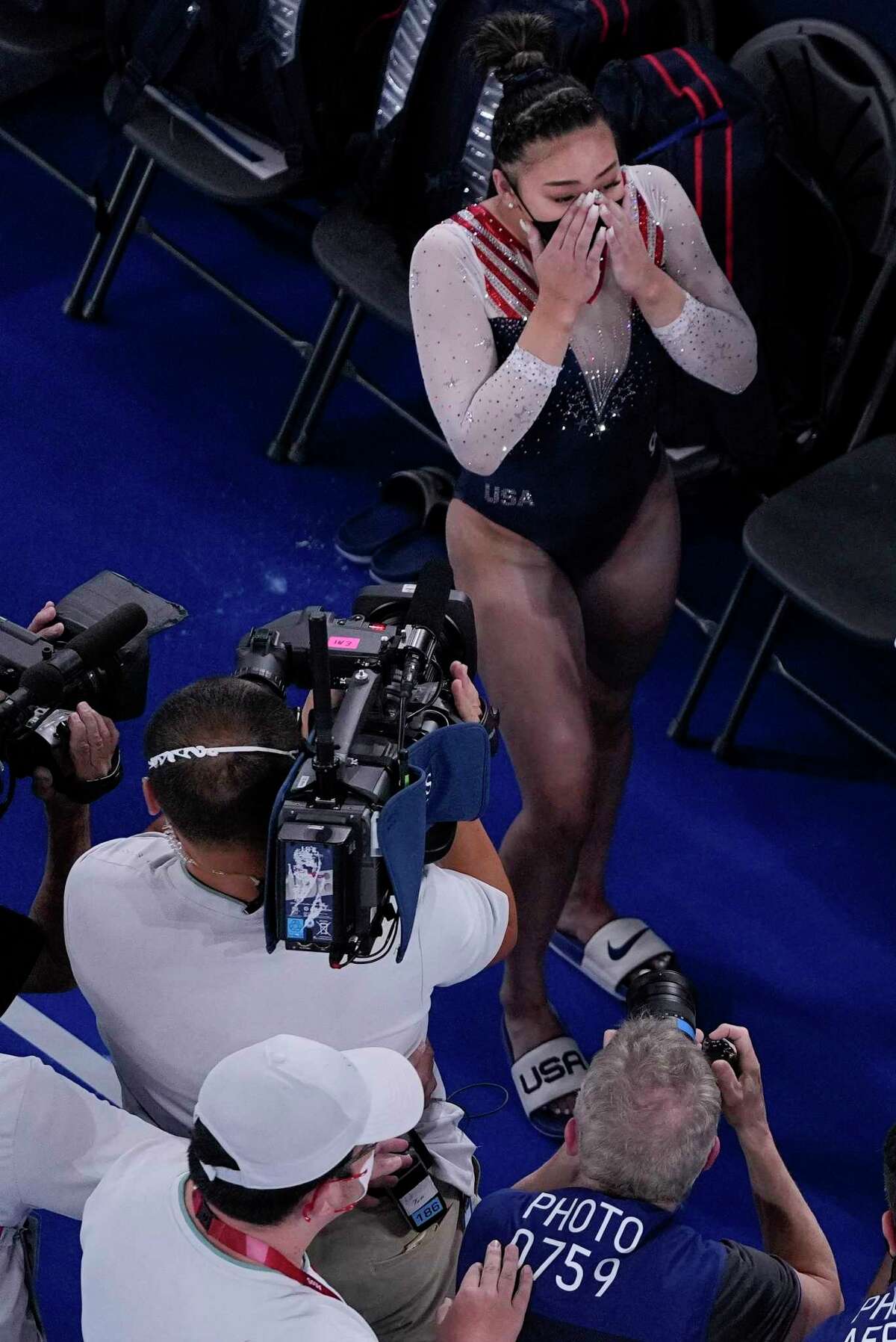 Sunisa Lee, of the United States, reacts as she learns she won the gold medal during the artistic gymnastics women's all-around final at the 2020 Summer Olympics, Thursday, July 29, 2021, in Tokyo.