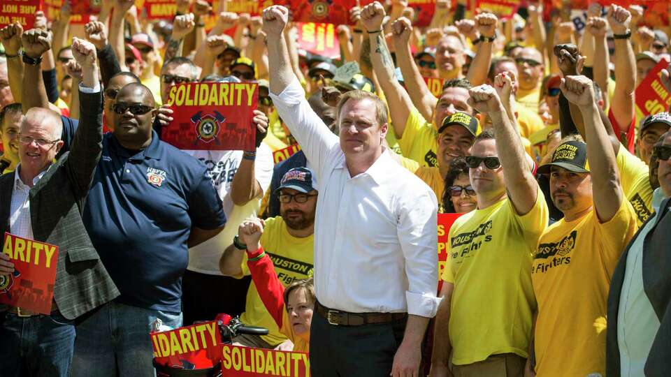 Marty Lancton, the head of the Houston Professional Fire Fighters Association, stands with his membership during a march on City Hall over the labor dispute related to Proposition B in March 2019.