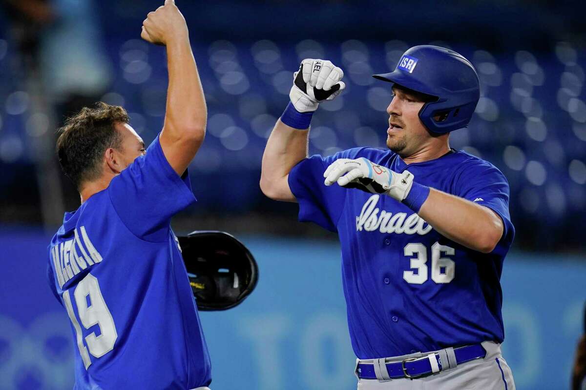 Israel's Ryan Lavarnway (36) celebrate with Danny Valencia after hitting a home run in the sixth inning of a baseball game against South Korea at the 2020 Summer Olympics, Thursday, July 29, 2021, in Yokohama, Japan. (AP Photo/Sue Ogrocki)