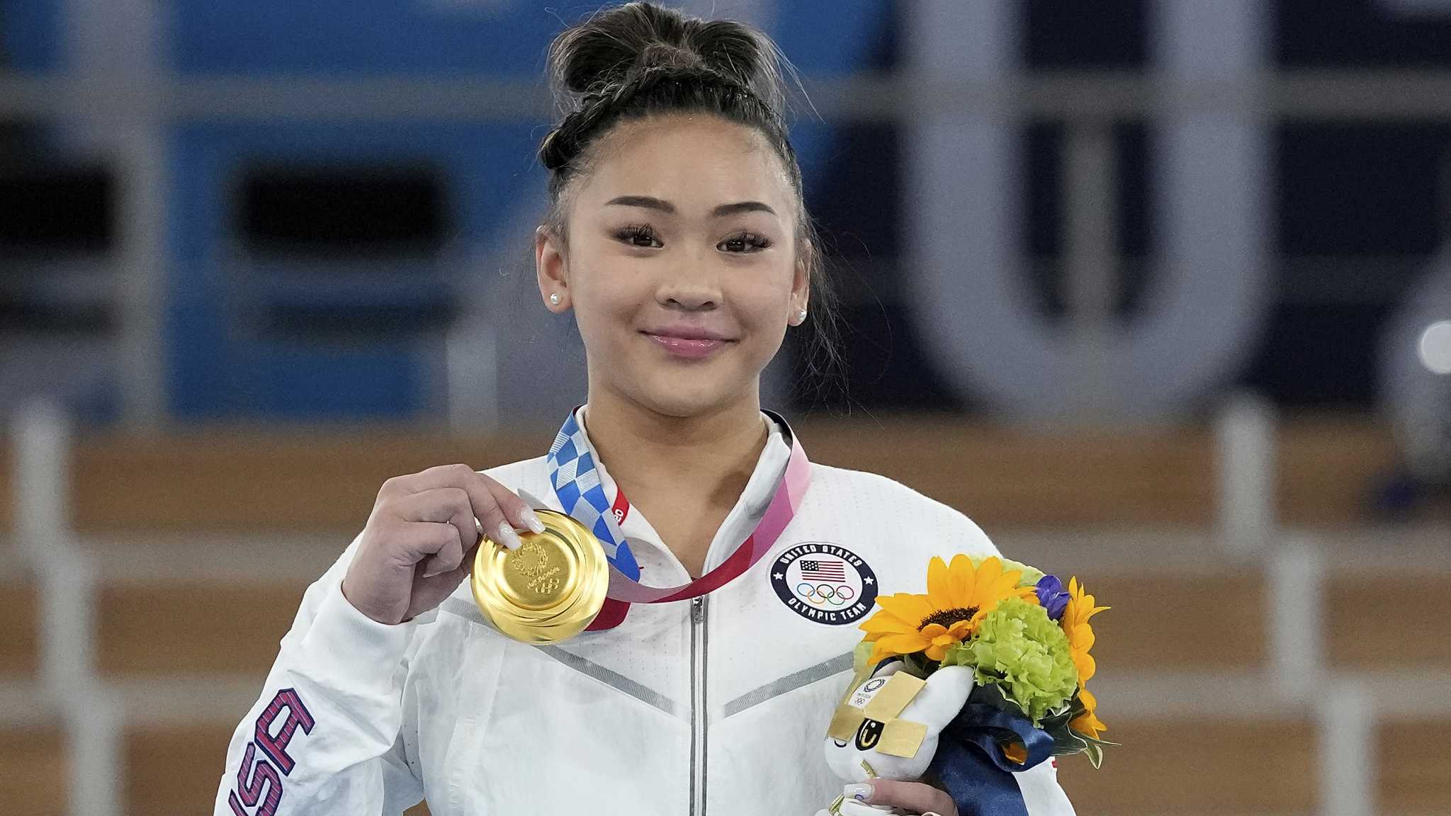 Sunisa Lee wins gold in all-around gymnastics, as Biles watches from stands