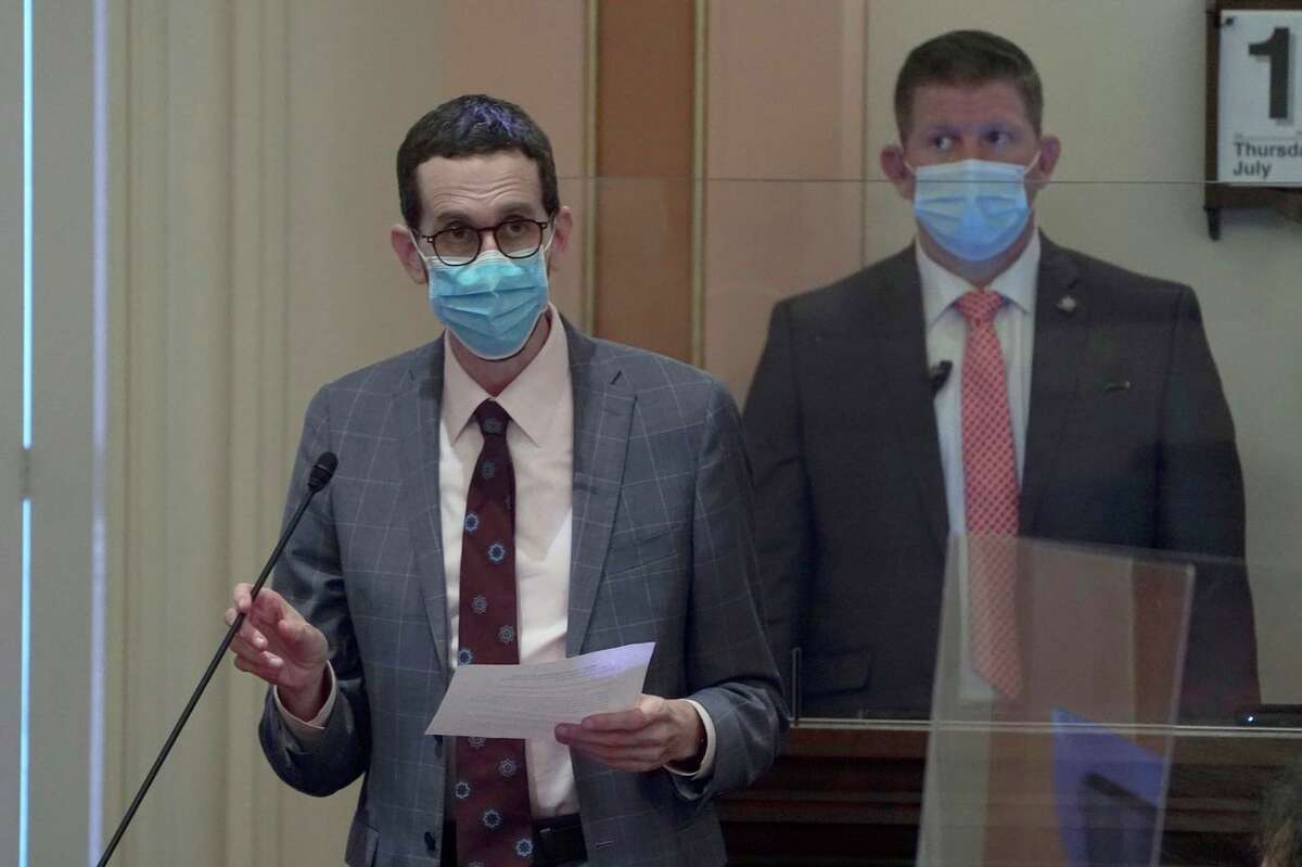 State Sen. Scott Wiener, D-San Francisco, wears a face mask as he speaks on the floor of the Senate in Sacramento this month. Face masks were already required at the Capitol; now all of Sacramento County will require them.