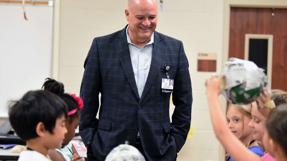 Cy-Fair ISD Superintendent Mark Henry visits with students in school over the summer.