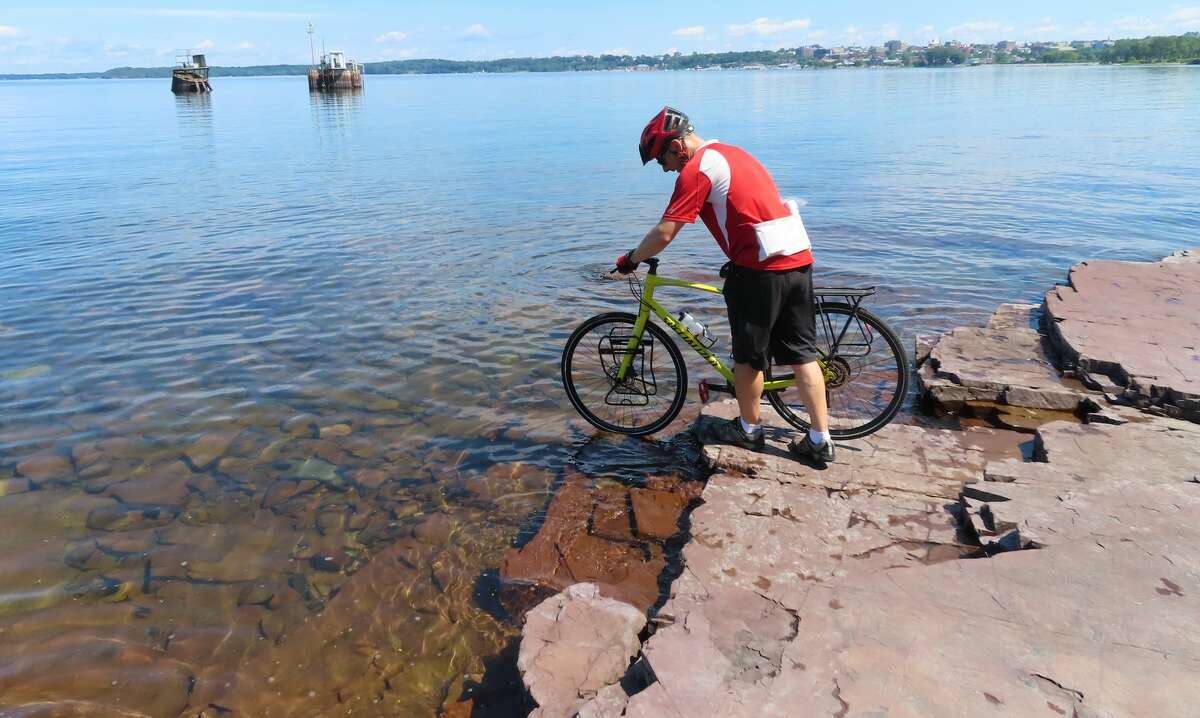 Herb Terns does a ceremonial tire dip in Lake Champlain to begin the trip.