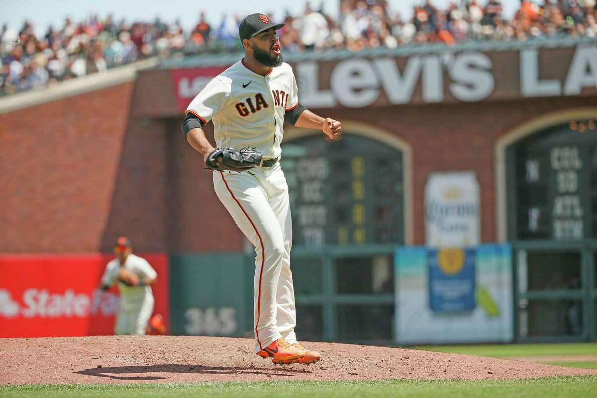 San Francisco Giants relief pitcher Jarlin Garcia (66) reacts after striking out Los Angeles Dodgers Cody Bellinger to end the top of the sixth inning with the bases loaded during an MLB game at Oracle Park, Thursday, July 29, 2021, in San Francisco, Calif.