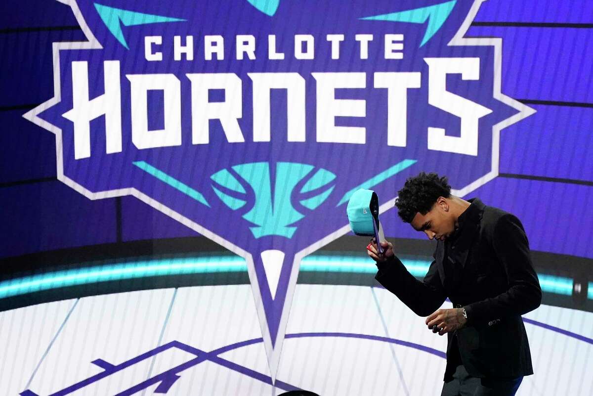 James Bouknight steps off the stage after being selected 11th overall by the Charlotte Hornets during the NBA Draft on Thursday.