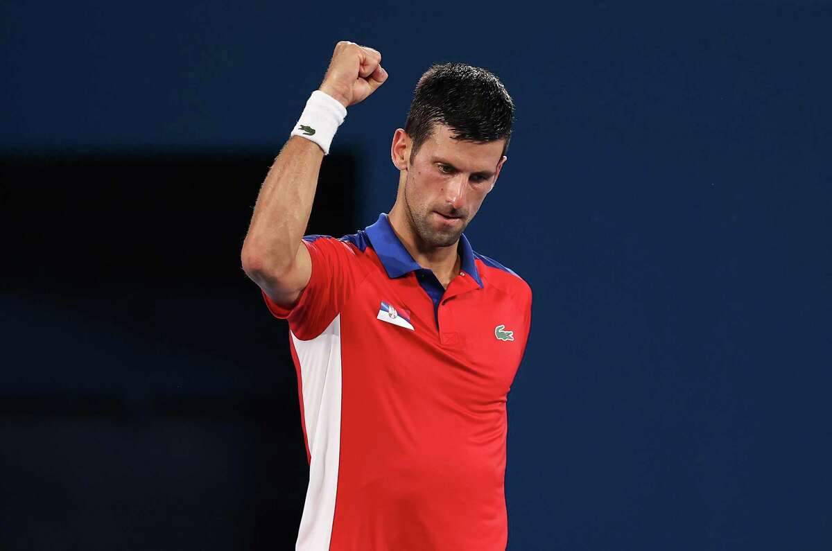 TOKYO, JAPAN - JULY 29: Novak Djokovic of Team Serbia celebrates victory after his Men's Singles Quarterfinal match against Kei Nishikori of Team Japan on day six of the Tokyo 2020 Olympic Games at Ariake Tennis Park on July 29, 2021 in Tokyo, Japan. (Photo by Clive Brunskill/Getty Images)