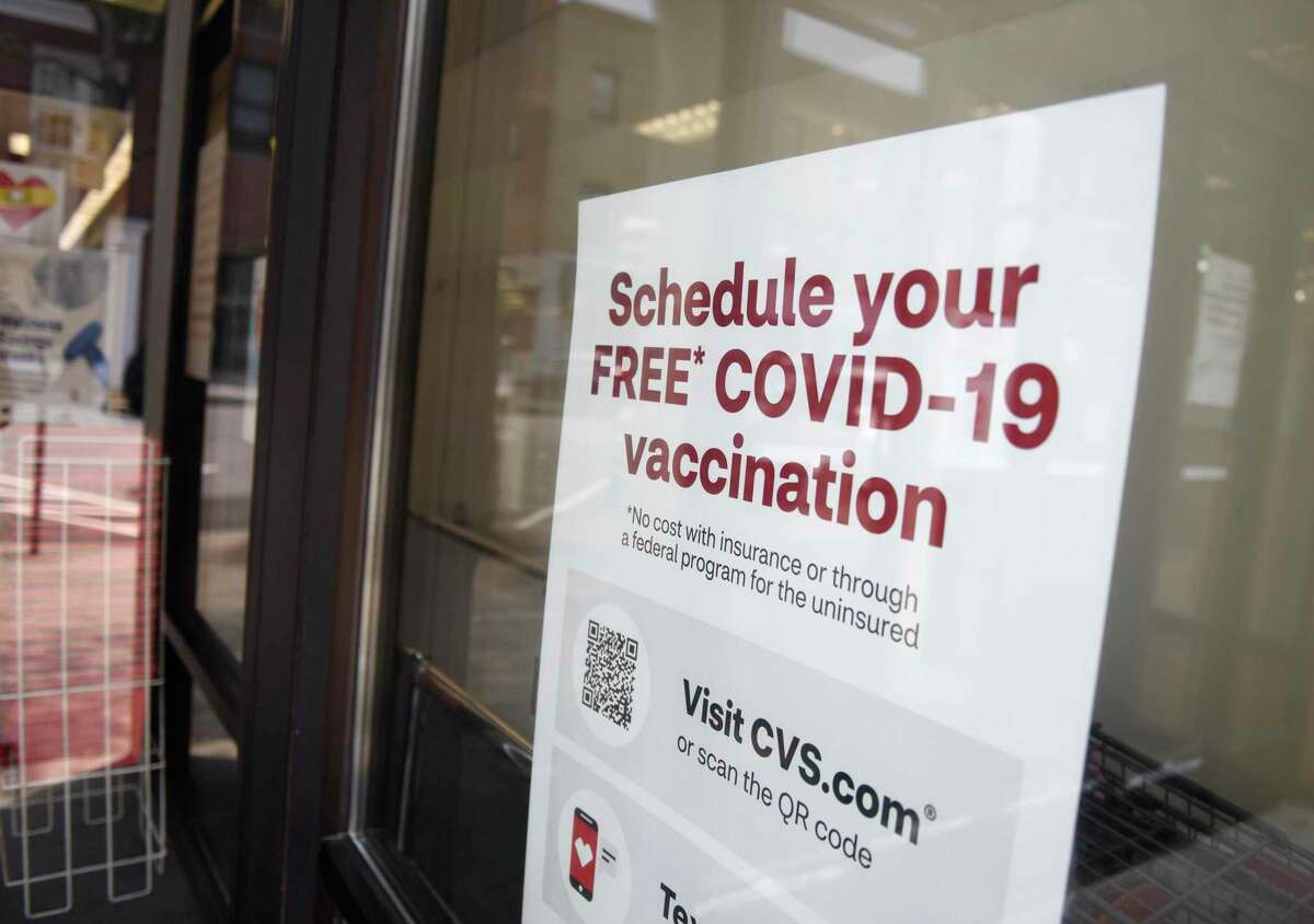 A sign promotes COVID-19 vaccines in July 2021 at a CVS Pharmacy in Greenwich, Conn.
