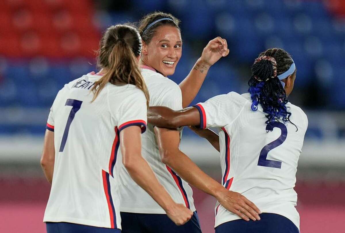 Lynn Williams (center) celebrates with teammates after her goal put the U.S. ahead 2-1 in the 31st minute.