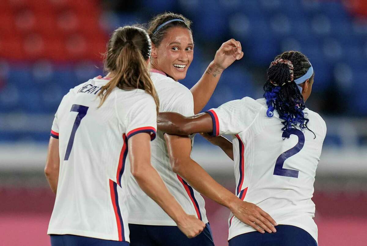 United States' Lynn Williams, center, celebrates with teammates after scoring a goal against Netherlands during a women's quarterfinal soccer match at the 2020 Summer Olympics, Friday, July 30, 2021, in Yokohama, Japan.