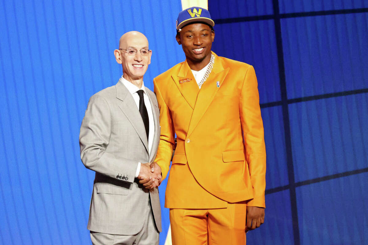 NBA Commissioner Adam Silver and Jonathan Kuminga pose for photos after Kuminga was drafted by the Golden State Warriors in the 2021 NBA Draft at Barclays Center.