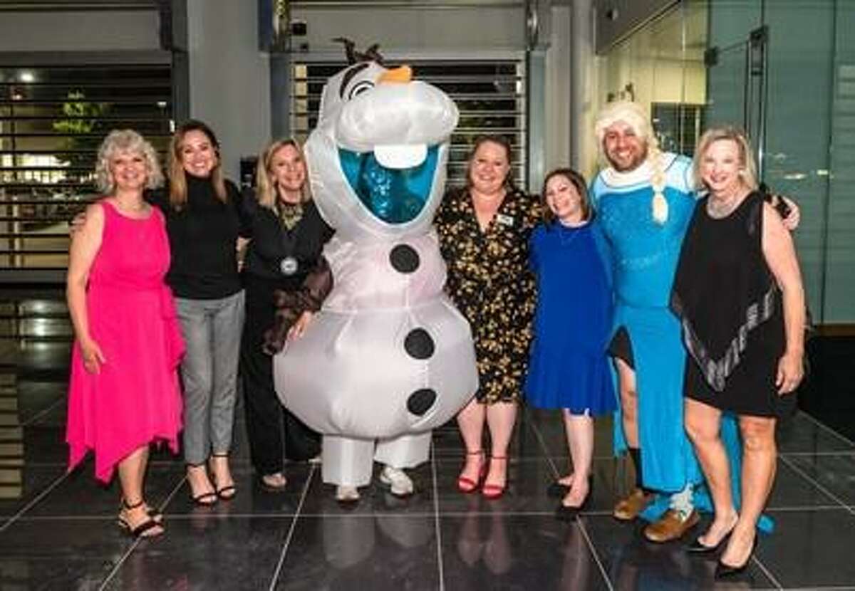 Pictured from left are: Dannette Suding, CEO of YES to YOUTH; Brooke Baugh and Ann Wolford of The Wolford Group; Rachel Richmond (in Frozen’s Olaf costume) of Richmond Realty RE/MAX The Woodlands & Spring; Mindy Reynolds and Penny Wilson of YES to YOUTH; and Zach Richmond and Marlys Mulkey of Richmond Realty RE/MAX The Woodlands & Spring.