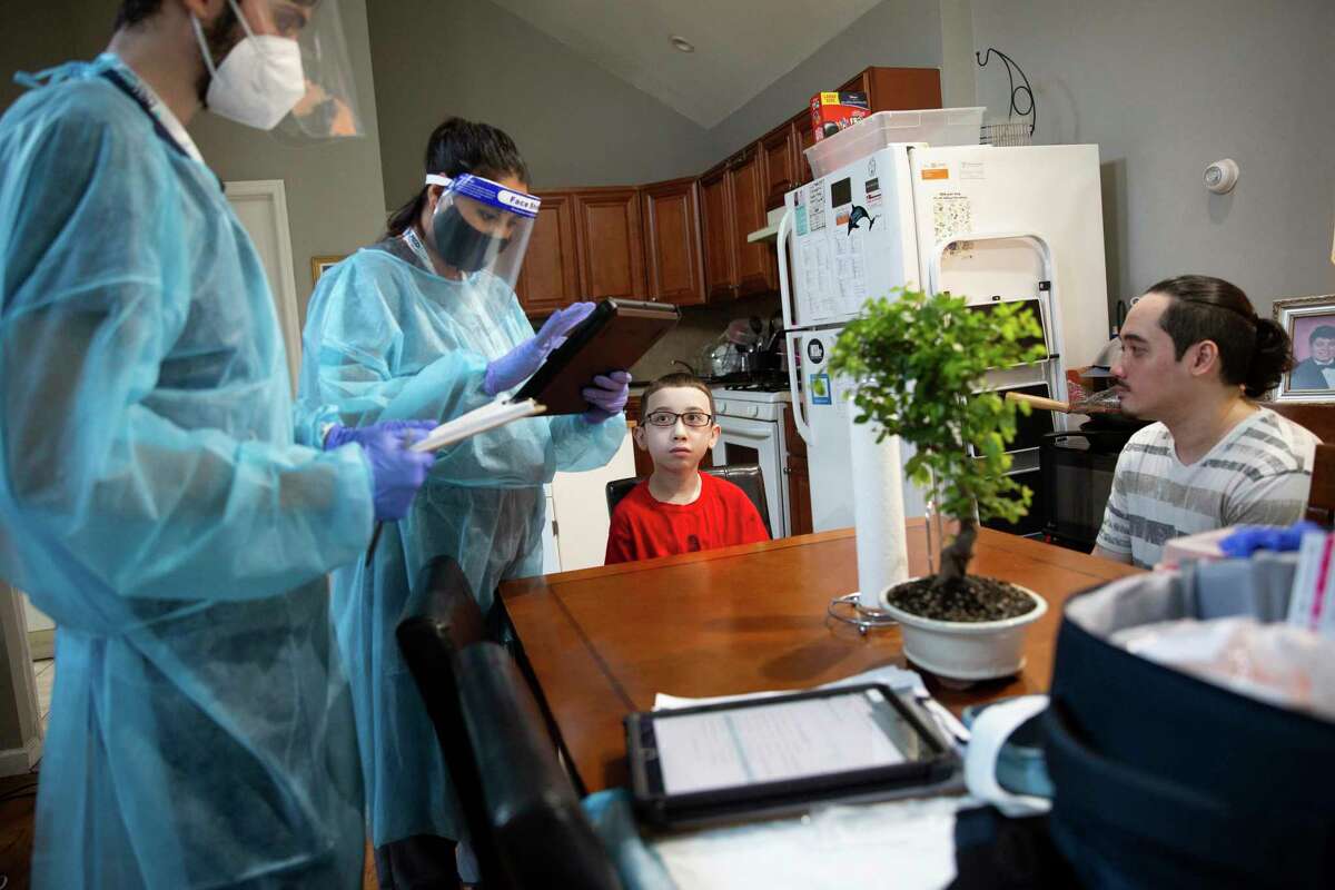 Eli Nazario, 13, who has serious allergies and asthma, receives the second dose of the Pfizer coronavirus vaccine during an in-home visit on Staten Island, July 16, 2021. Staten Island has been a hot spot that presaged a broader uptick in coronavirus cases, and for weeks, several ZIP codes in the area had among the most cases in the city. (Olga Ginzburg/The New York Times)