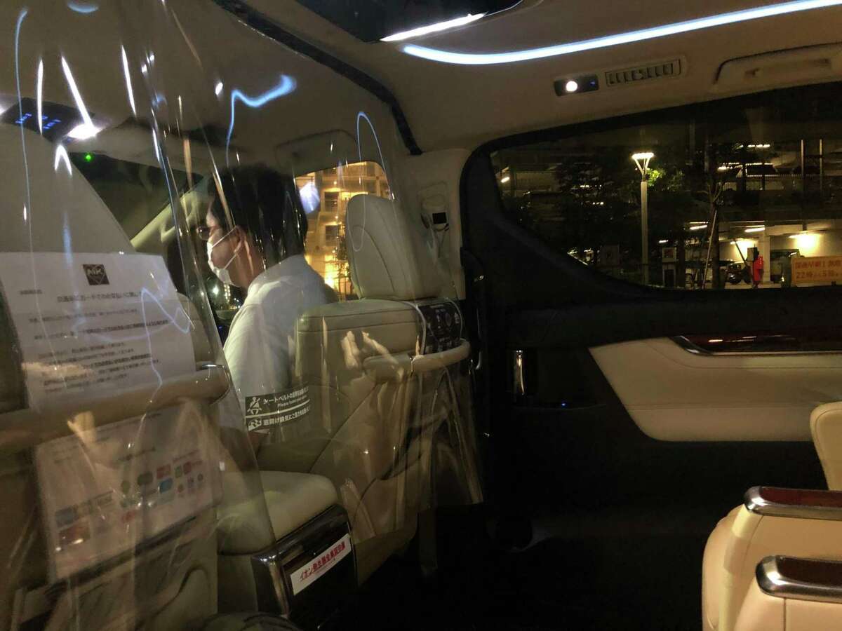Inside one of the taxis in Tokyo that Olympics organizers arranged for media to use because they aren't allowed to hail street taxis or ride public transit due to COVID protocols.