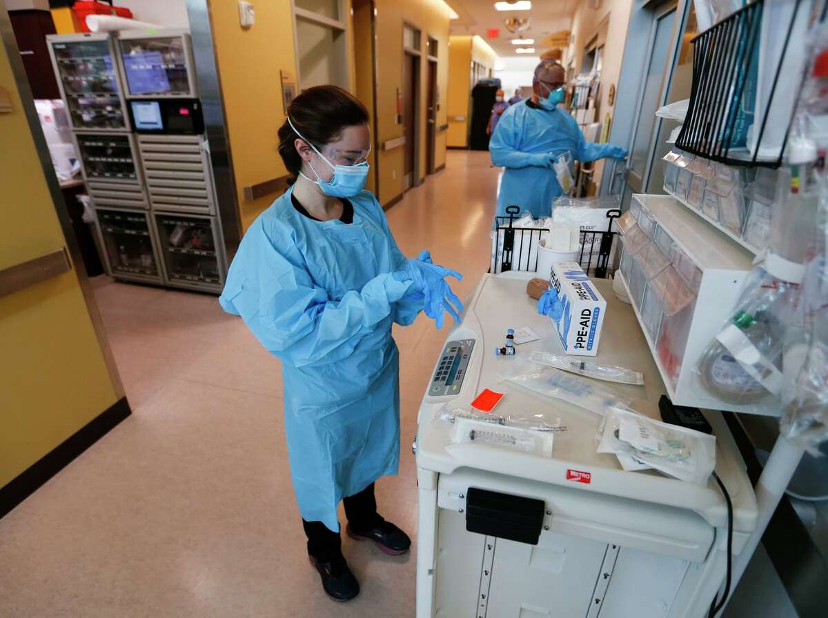 Nurses and doctors gear up to treat COVID-19 patients in the CoxHealth Emergency Department in Springfield, Mo. The delta variant is as transmissible as chicken pox, the CDC says.