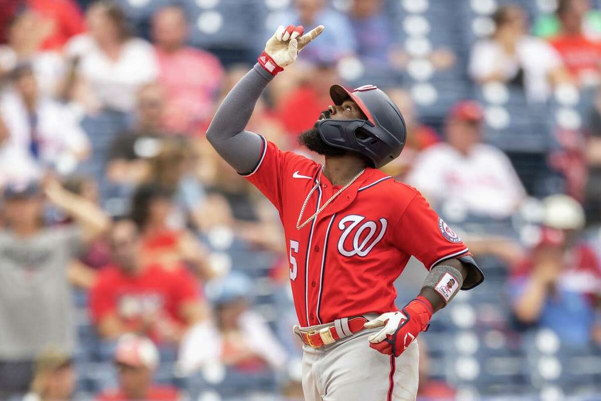 Washington Nationals' Josh Harrison gestures as he approaches home plate after hitting a two-run home run during the second inning of a baseball game against the Philadelphia Phillies, Thursday, July 29, 2021, in Philadelphia in the second game of a doubleheader. (AP Photo/Laurence Kesterson)