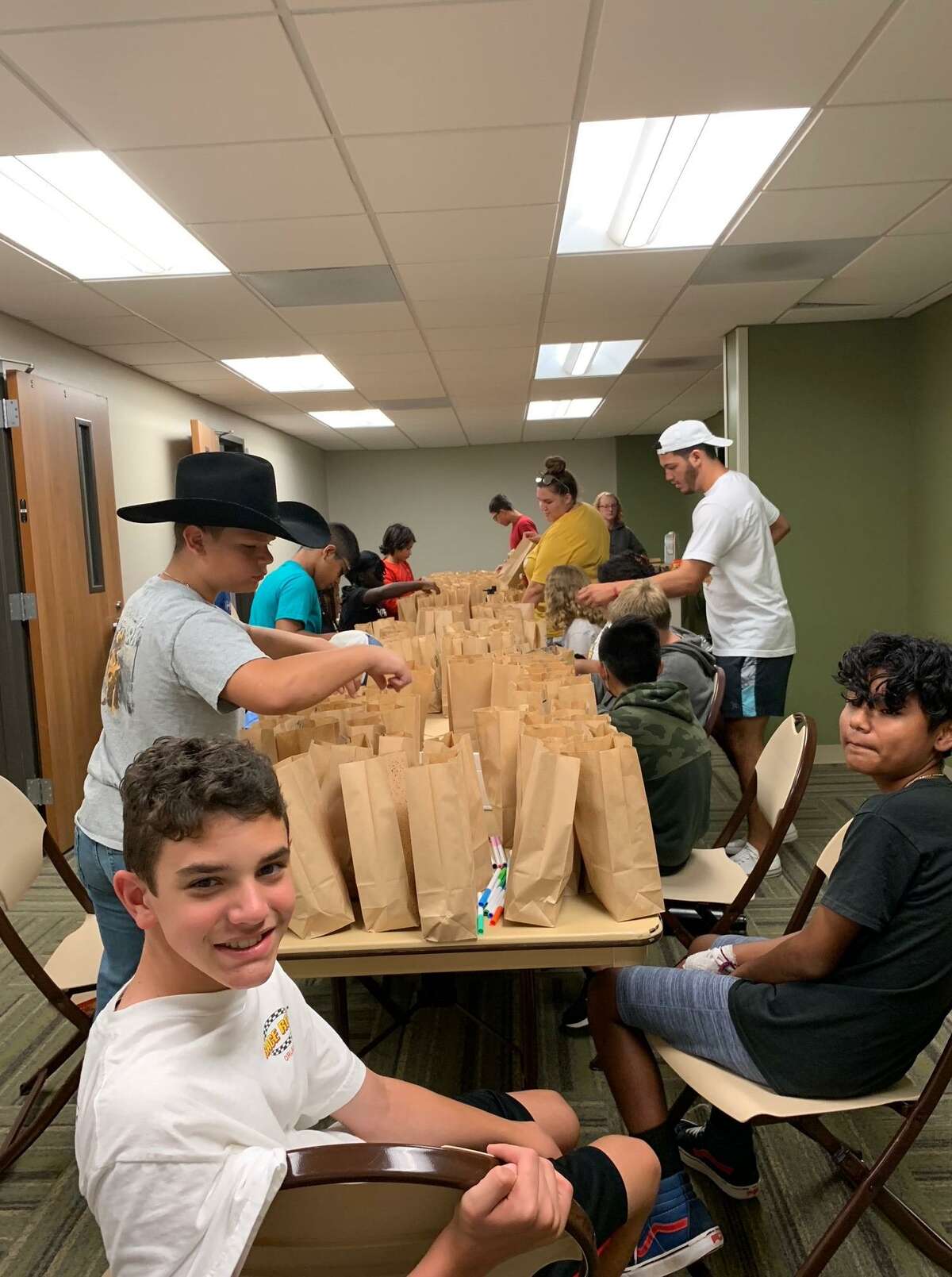 Service-loving teenagers in the Conroe recreation department's teen program decorated 200 bags with colorful drawing and positive phrases on Thursday and filled them with breakfast items for Montgomery County Meals on Wheels.