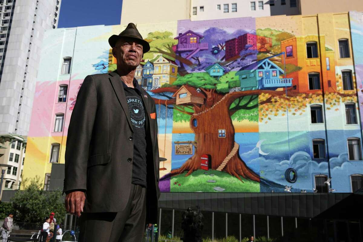 Del Seymour, founder of a job readiness program called Code Tenderloin, stands in front of a mural in the Tenderloin in San Francisco, Calif. Code Tenderloin will offer an eighth of an ounce of cannabis to everyone 21 or older who receive either their first or second jab on site.