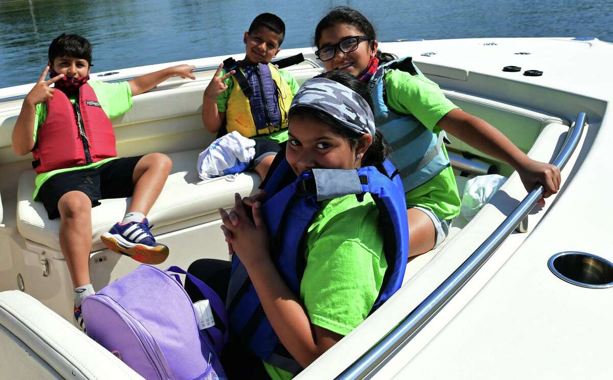 Campers from ROSCCO (Rogers School Community Center Organization) summer vacation program enjoy the water during the Noroton Yacht Club's 25th annual Boat/Camp Friday July 30, 2021, at the Yacht Club in Darien, Conn. Person-to-Person, Darien Boat Club, Darien Police Marine Unit, Noroton Fire Department, Norwalk Seaport Association, United States Coast Guard Auxiliary--Norwalk Flotilla 72 and Darien Sail and Power Squadron partner to provide a safe on-the-water experience for underserved children.