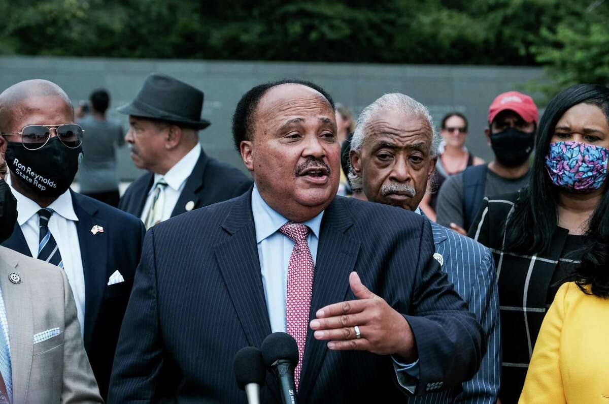 Martin Luther King III, center, speaks during a press conference with members of the Texas State Democratic Delegation at the Martin Luther King, Jr. Memorial in Washington, on Wednesday, July 28, 2021. (Michael A. McCoy/The New York Times)