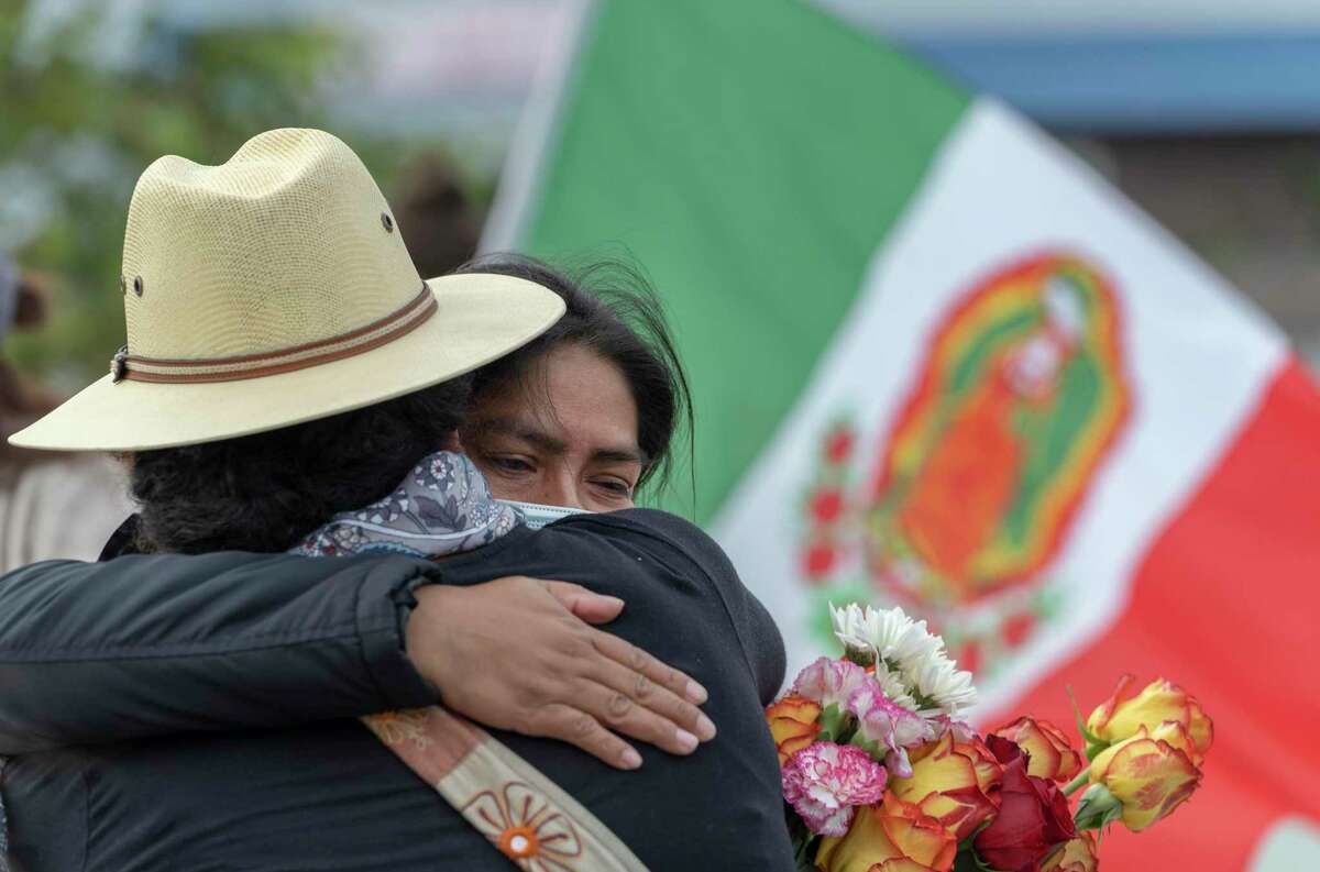 At center, Paulina Martinez Chavez, mother of Gerardo Chavez Martinez, hugs a supporter during a rally in support of her family in front of the Salinas Police Department on Saturday, July 24, 2021 in Salinas, Calif.