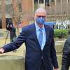 Former Bridgeport Personnel Director David Dunn leaves the United States Court House Federal Building in downtown Bridgeport, Conn., on Tuesday April 13, 2021. Dunn was at the courthouse to be sentenced for his involvement in the police chief cheating scandal.