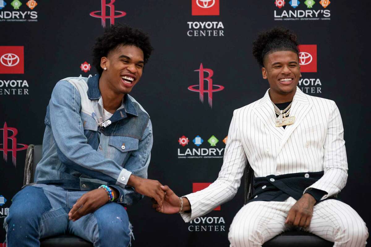 New Houston Rockets Josh Christopher and Jalen Green laugh as they talk about how they think the other one plays the game during an introductory press conference for the players acquired in Thursday's NBA draft, Friday, July 30, 2021, at Toyota Center in Houston.