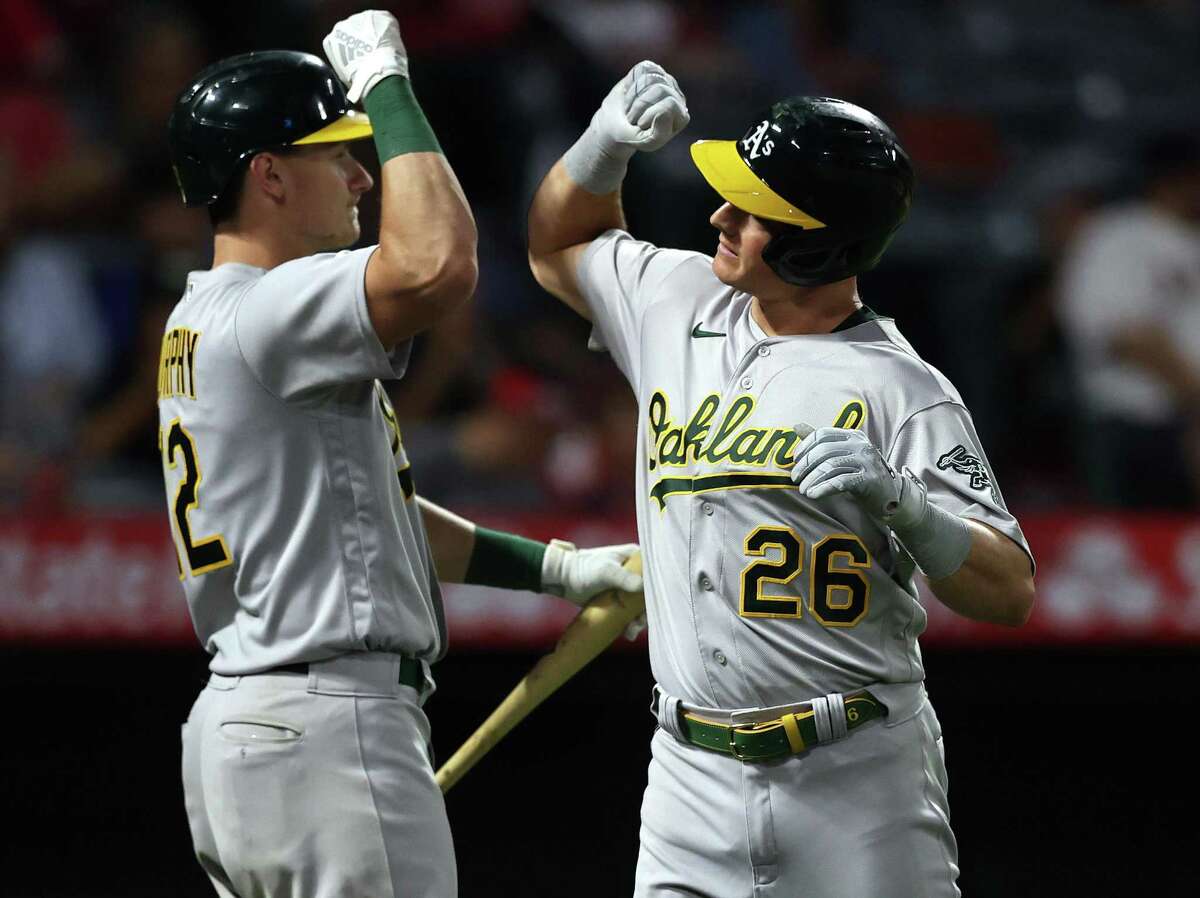 ANAHEIM, CALIFORNIA - JULY 30: Matt Chapman #26 of the Oakland Athletics celebrates a home run with Sean Murphy #12 against the Los Angeles Angels in the eighth inning at Angel Stadium of Anaheim on July 30, 2021 in Anaheim, California. (Photo by Ronald Martinez/Getty Images)