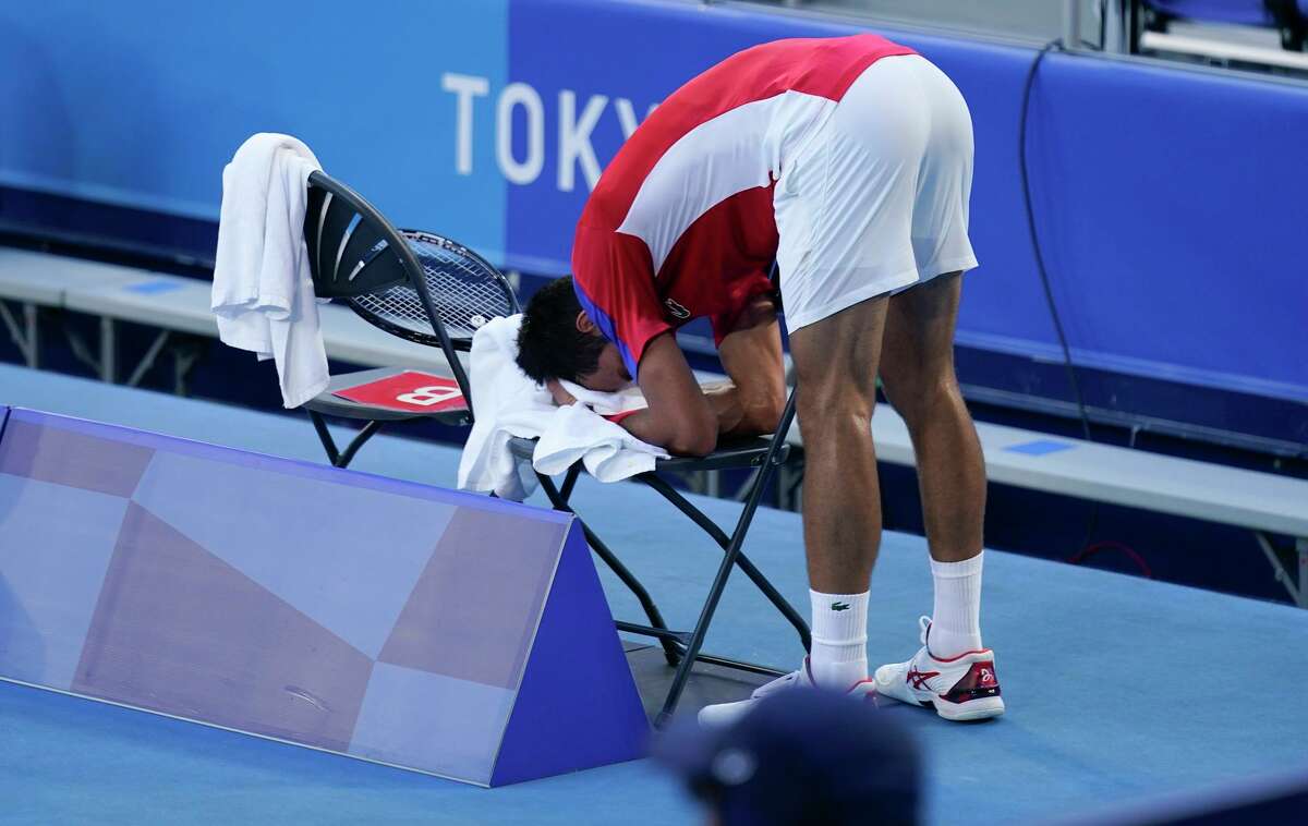 Novak Djokovic of Serbia lost control of his emotions, and then the contest, during the bronze-medal match against Spain’s Pablo Carreno Busta at the 2020 Summer Olympics in Tokyo. He later withdrew from the mixed doubles bronze-medal match.