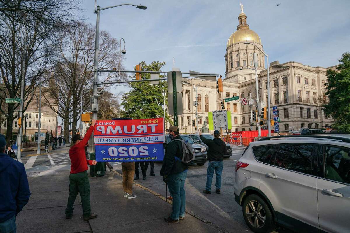 Supporters of former president Trump demonstrate outside the Georgia Capitol in Atlanta on Jan. 6.