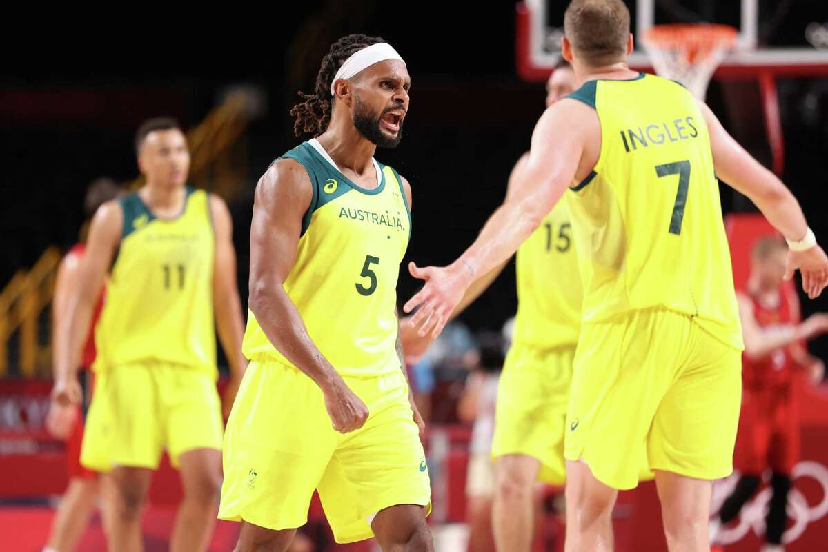 SAITAMA, JAPAN - JULY 31: Patty Mills #5 of Team Australia celebrates during Australia's Men's Basketball Preliminary Round Group B game against Germany on day eight of the Tokyo 2020 Olympic Games at Saitama Super Arena on July 31, 2021 in Saitama, Japan. (Photo by Gregory Shamus/Getty Images)