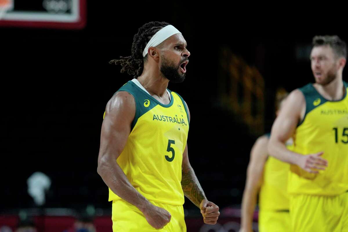 Australia's Patty Mills (5) celebrates after a score against Germany during a men's basketball preliminary round game at the 2020 Summer Olympics, Saturday, July 31, 2021, in Saitama, Japan. (AP Photo/Eric Gay)