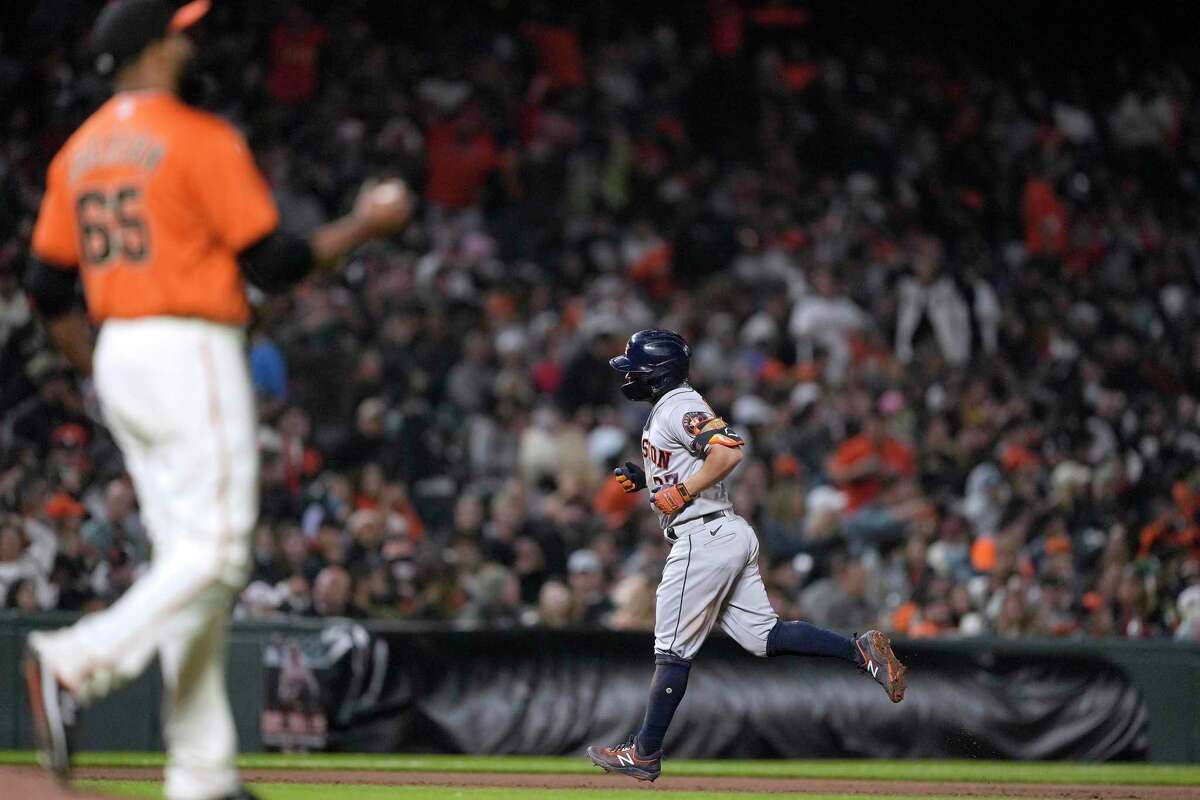 Houston Astros' Jose Altuve runs the bases after hitting a grand slam off San Francisco Giants relief pitcher Jay Jackson (65) during the sixth inning of a baseball game Friday, July 30, 2021, in San Francisco. (AP Photo/Tony Avelar)