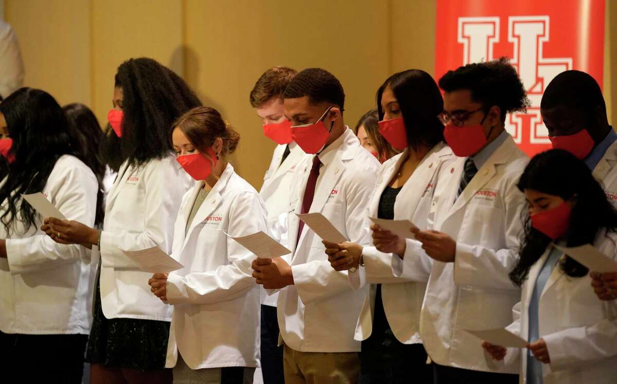 University of Houston medical students recite their student oath during the White Coat Ceremony held at the Hilton UH Saturday, July 31, 2021 in Houston.