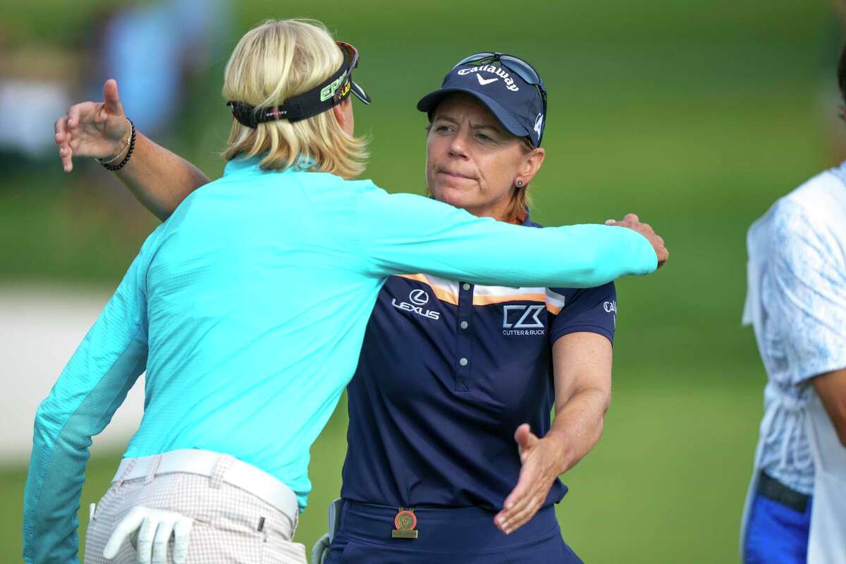 Annika Sorenstam, right, hugs Liselotte Neumann after the third round of the U.S. Senior Women’s Open on Saturday in Fairfield.