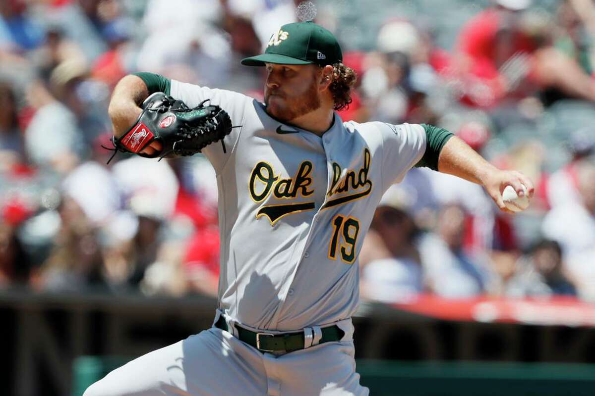 Oakland Athletics starting pitcher Cole Irvin throws to a Los Angeles Angels batter during the second inning of a baseball game in Anaheim, Calif., Saturday, July 31, 2021. (AP Photo/Alex Gallardo)