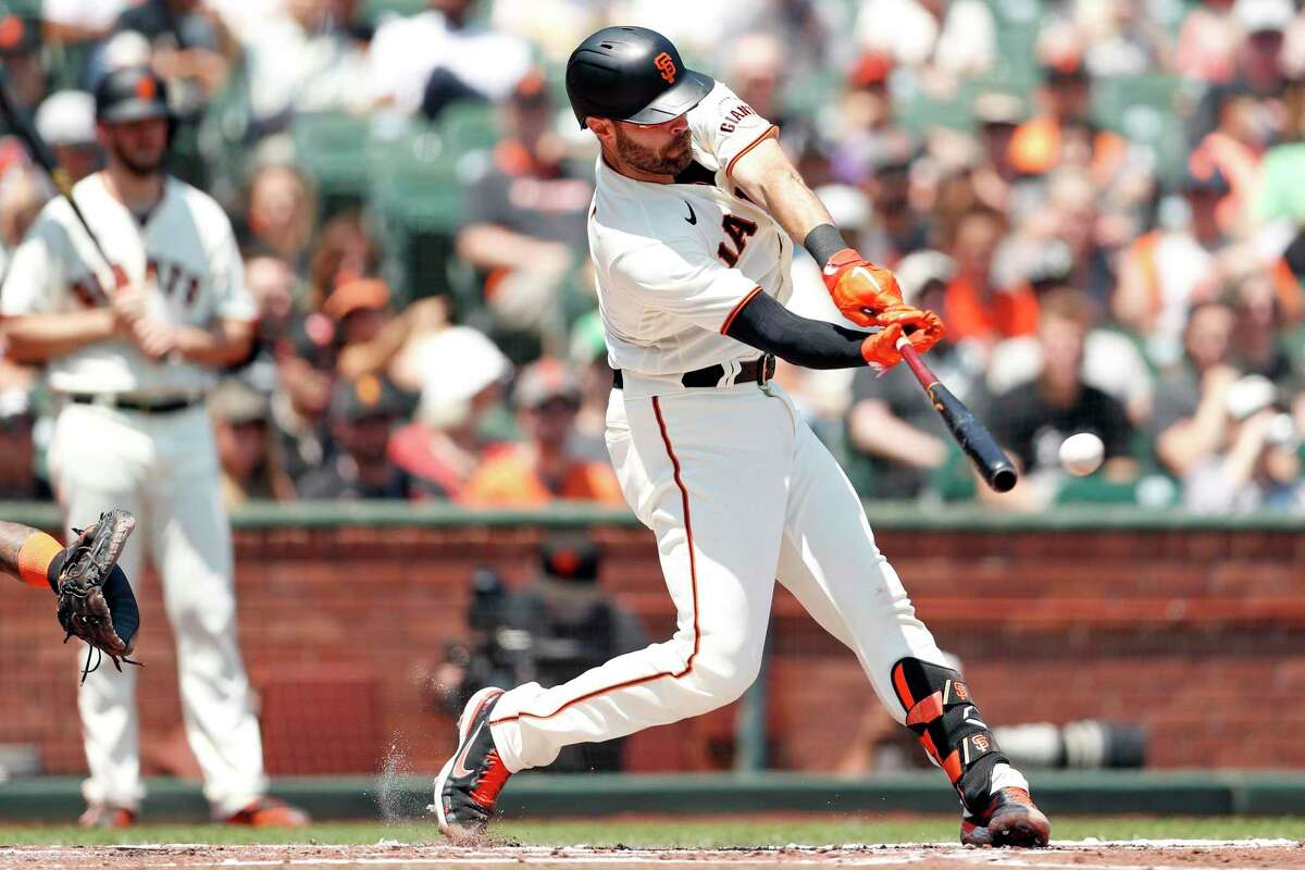 San Francisco Giants' Curt Casali hits a double in 2nd inning against Houston Astros during MLB game at Oracle Park in San Francisco, Calif., on Saturday, July 31, 2021.