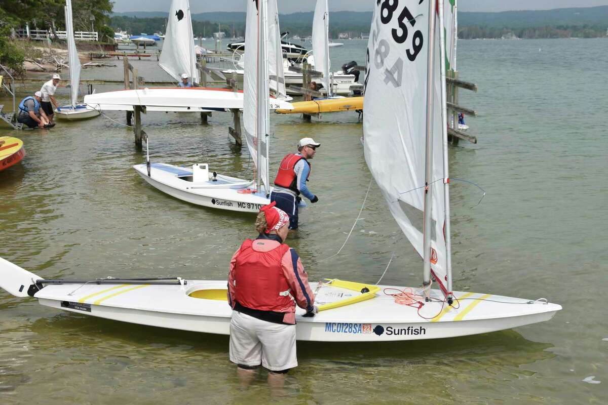Eleven Sunfish racers ready to set sail around Portage Lake on Saturday afternoon during an event tied to the Onekama's 150th celebrations. (Arielle Breen/News Advocate)