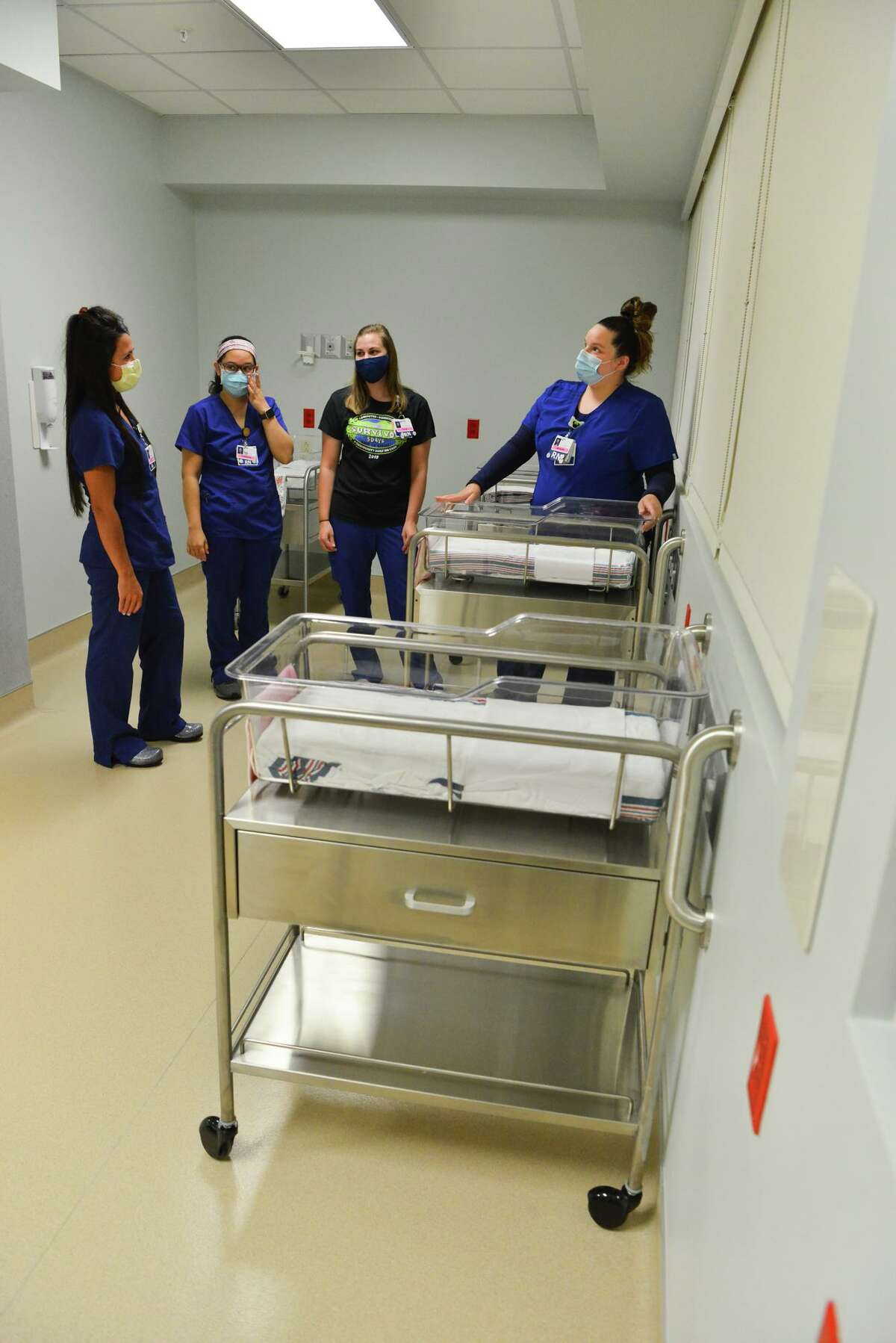 Women's Services nurses Rachel Lowry, Charissa Morrison, Kylie Voigt and Megan Trejo discuss equipment during a tour of the newly upgraded Women's Services Unit at Baptist Mission Trail Hospital on July 27, 2021.