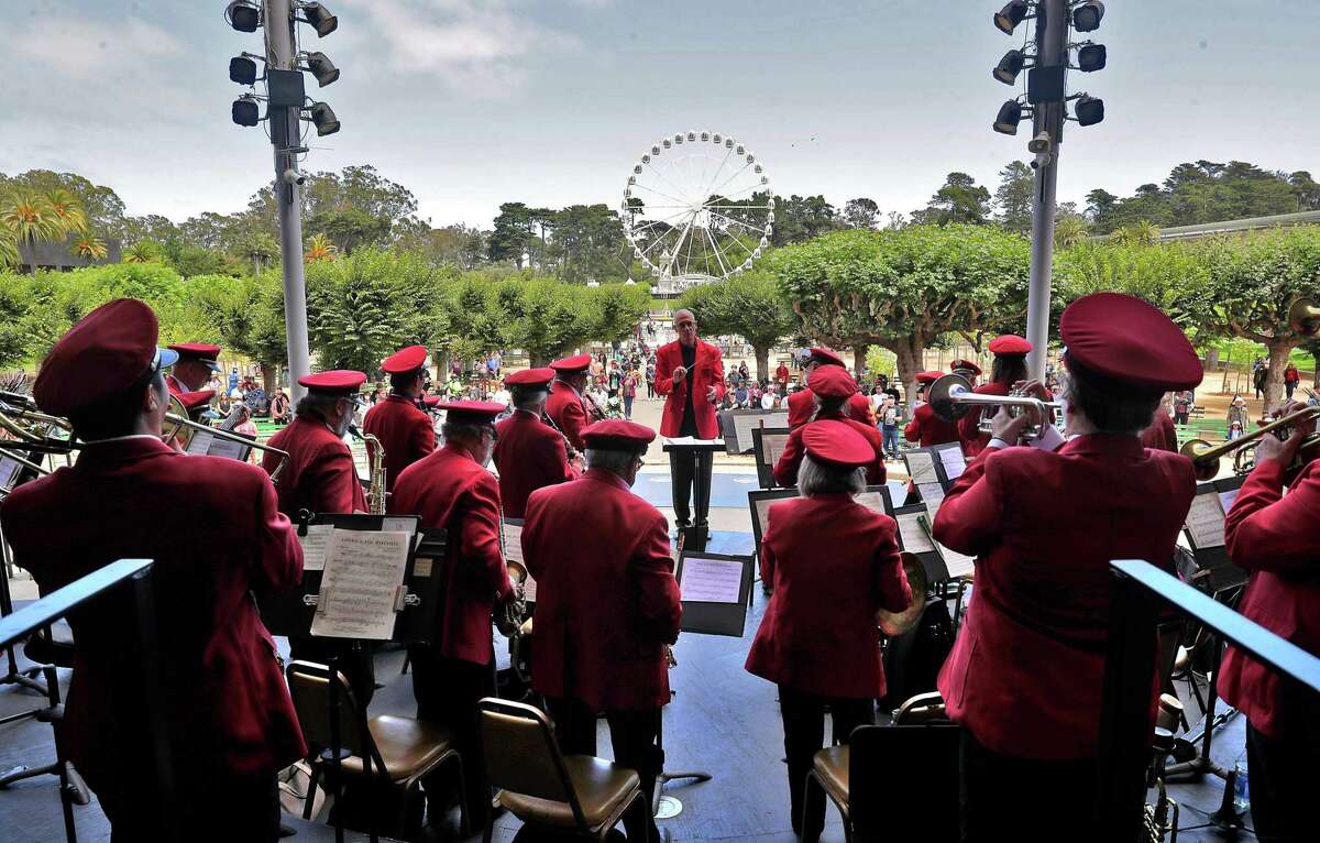Bob Calonico leads the Golden Gate Park Band in San Francisco as performers return for free summer concerts after a pandemic absence.