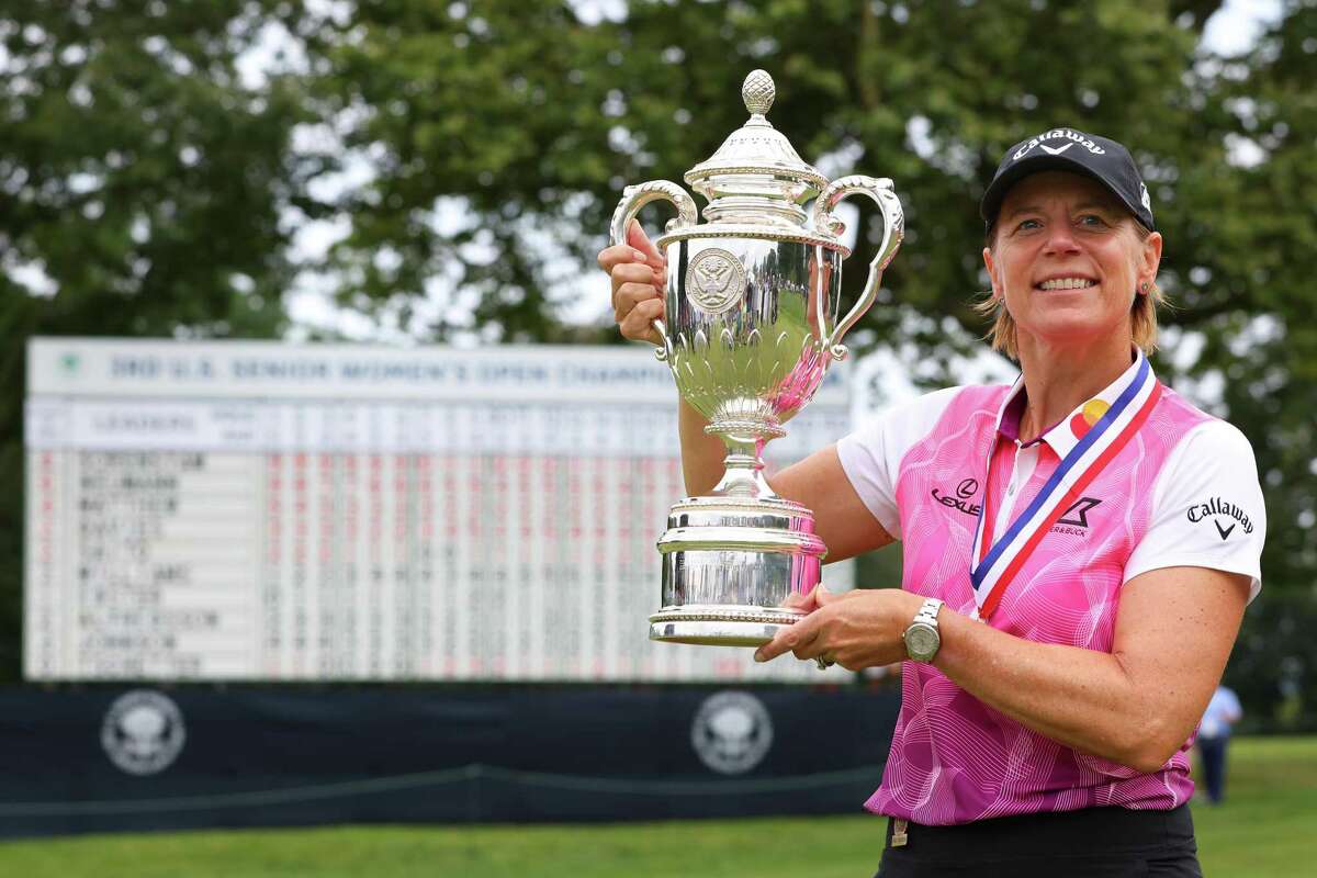 Annika Sorenstam holds up the trophy after winning the 2021 U.S. Senior Women’s Open at Brooklawn Country Club on Sunday in Fairfield.