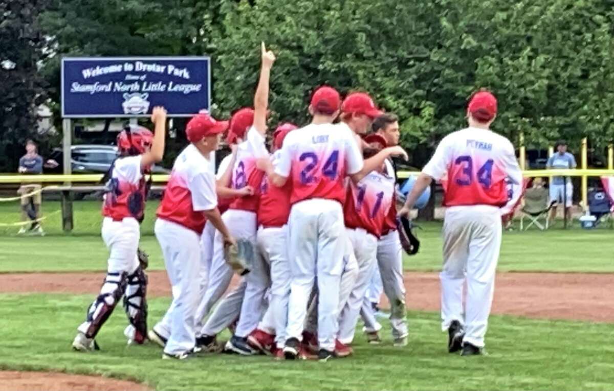 Manchester celebrates a state title win in the Little League State Championship 10-0 over Wilton