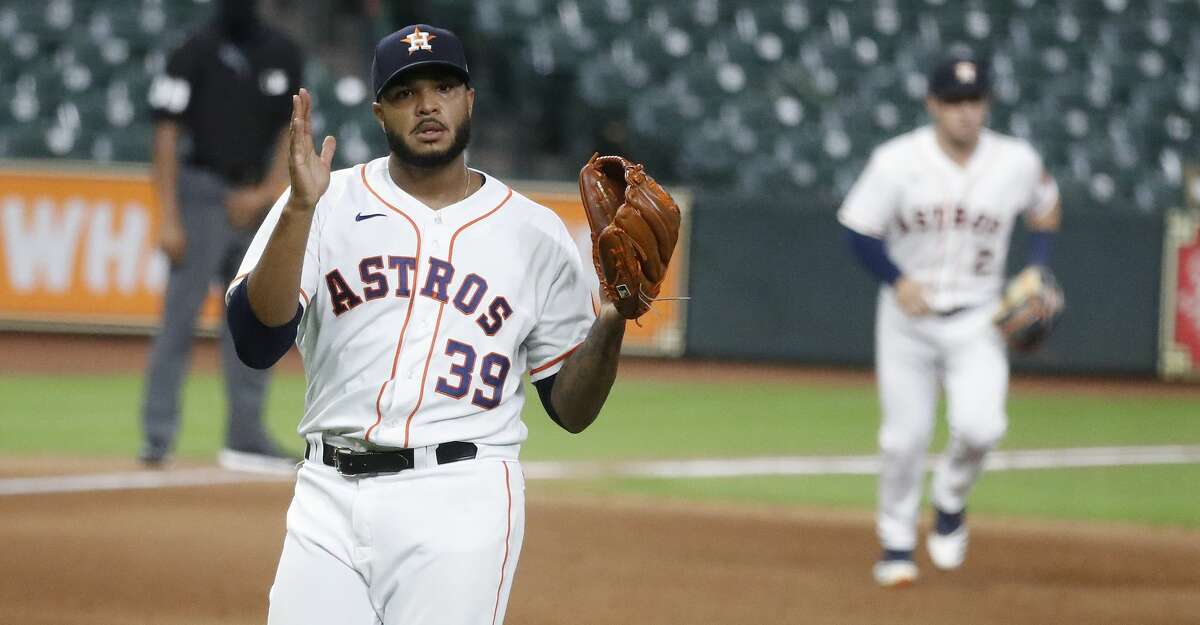 Houston Astros relief pitcher Josh James (39) reacts after striking out Colorado Rockies Trevor Story to get out of the eighth inning of an MLB baseball game at Minute Maid Park, Monday, August 16, 2020, in Houston.
