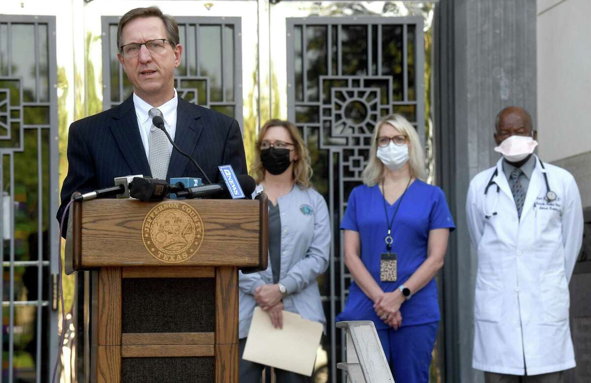 Jefferson County Judge Jeff Branick gathered with county health officials and others to address a spike in COVID-19 cases that is beginning to tax local hospitals. He urged residents to seriously consider getting fully vaccinated. if they have not done so and to wear masks and practice social distancing if they are unvaccinated. Photo made Thursday, July 29, 2021 Kim Brent/The Enterprise