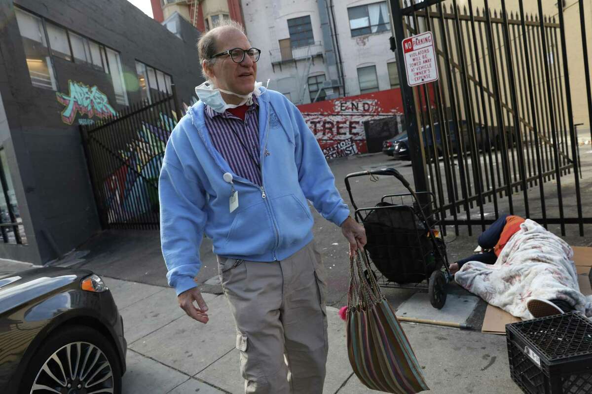 Dr. Barry Zevin, medical director for street medicine at the San Francisco Department of Public Health, walks on Grove Street to his office at SFDPH after the announcement of a new Street Overdose Response Team (SORT) on August 2, 2021 in San Francisco.