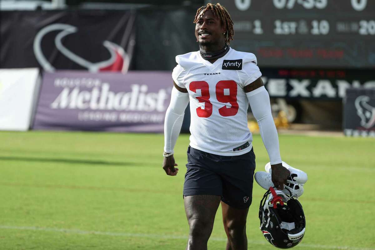 Houston Texans cornerback Terrance Mitchell walks onto the field during an NFL training camp football practice Monday, Aug. 2, 2021, in Houston.