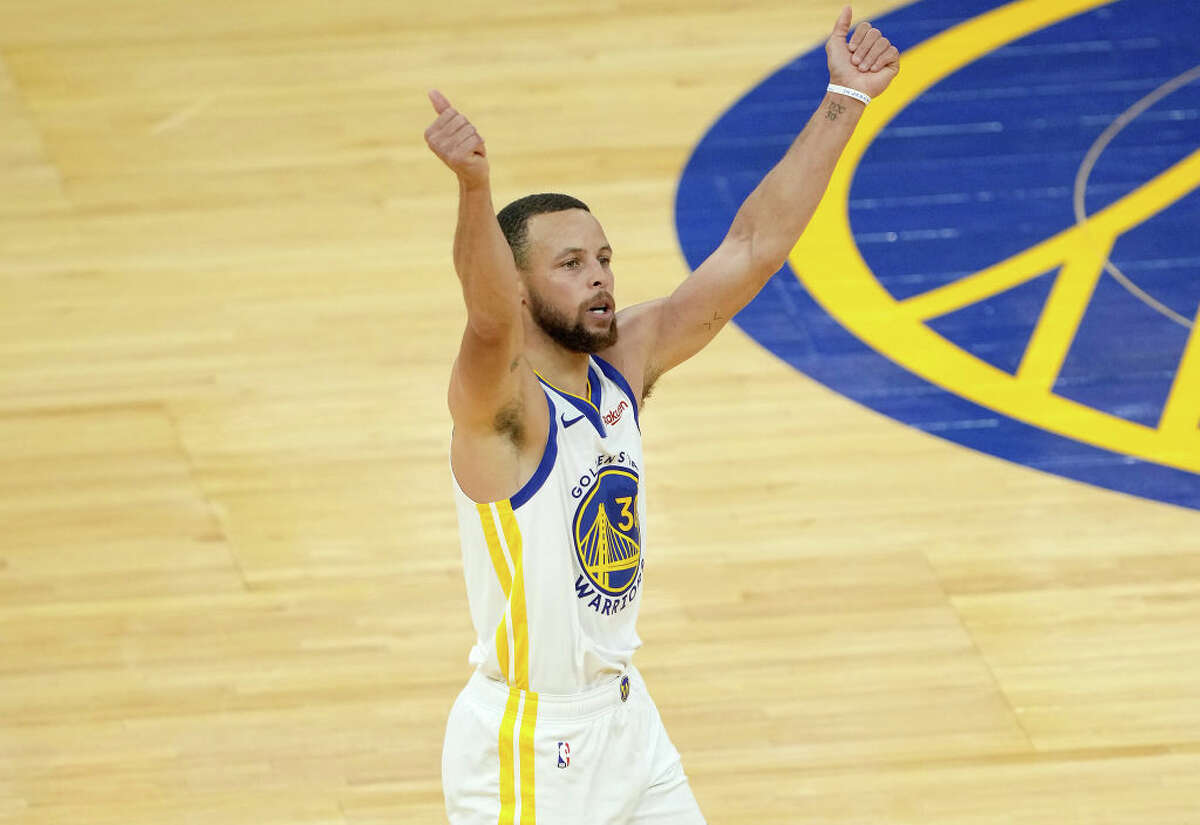 Stephen Curry of the Golden State Warriors celebrates after shooting and making a three-point shot against the Memphis Grizzlies during the second half of an NBA basketball game at Chase Center on May 16, 2021 in San Francisco, California.